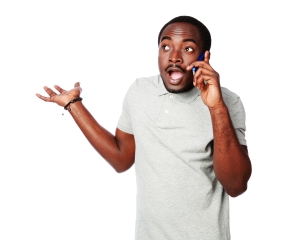 Surprised african man talking on the phone isolated on a white background